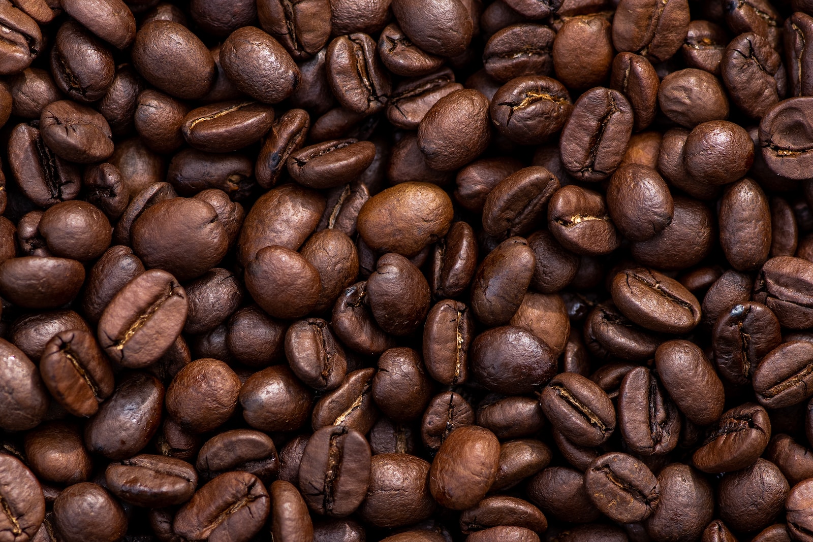 brown coffee beans on brown wooden table